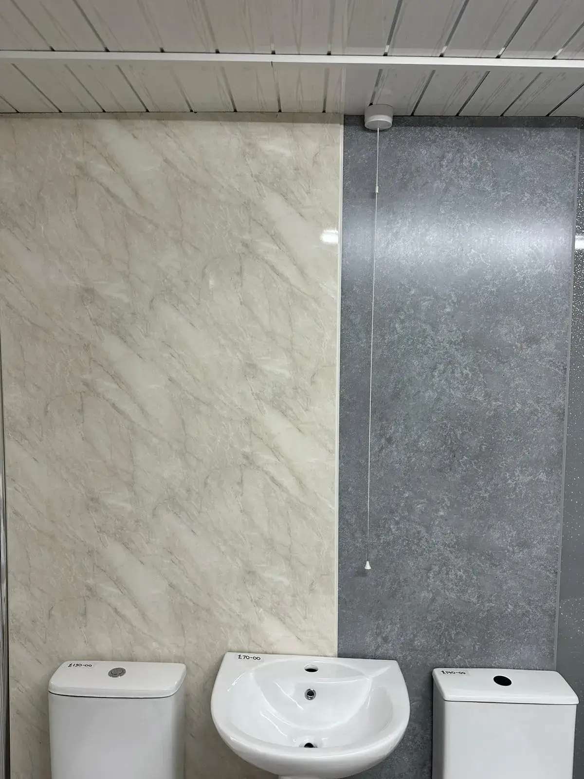 A bathroom with a sink and a toilet.